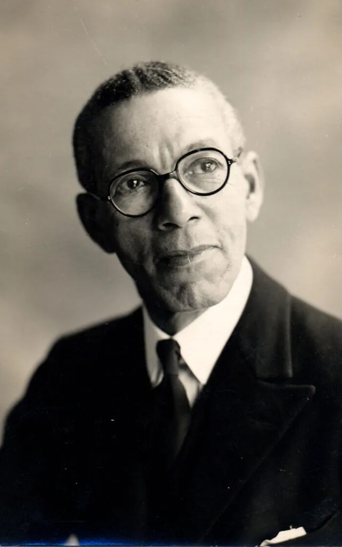 A black and white portrait of Edward Tull-Warnock