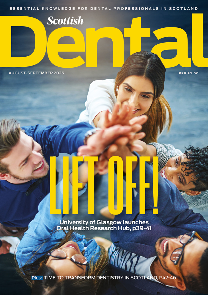 The August Scottish Dental mag cover annouces the 'Lift off' of Glasgow University's new oral health centre. A group of people Hi-Five towards the centre of the cover image.