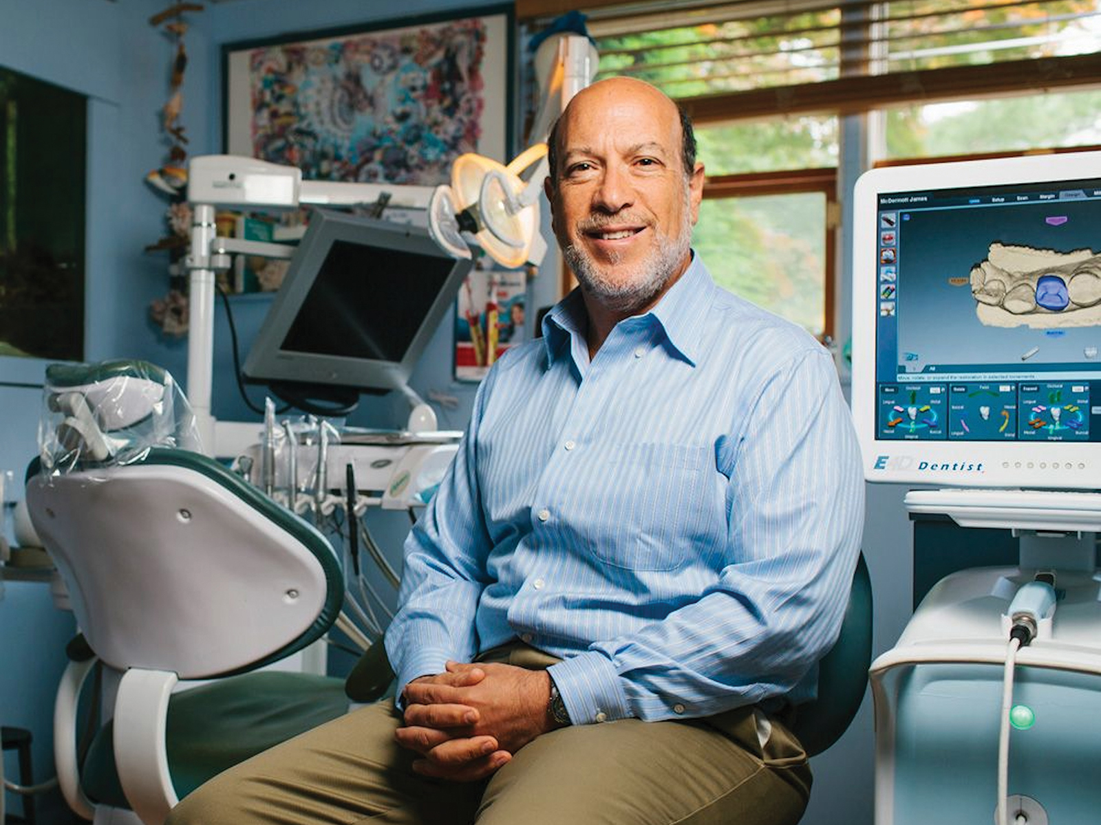 Dr Edward Zuckerberg sits in a dental surgery.