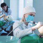 Trainee dentists practice techniques on dummy patients.