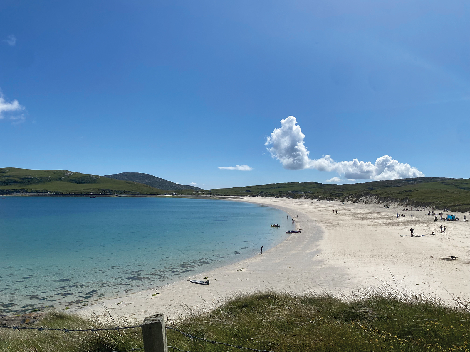 A pristine beach cove on a bright sunny day.