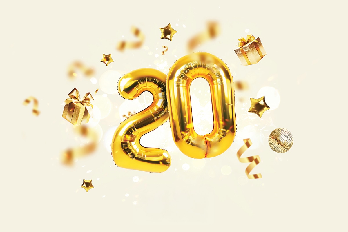 Foil balloons in the numbers 20, surrounded by 3D confetti in the shape of gifts, stars, ribbons and disco balls.