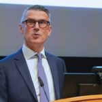 David Offord speaking at the podium.