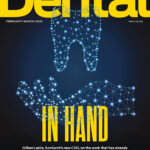 The cover of the February issue of Scottish Dental magazine. An illustration shows a tooth in hand made of a network of little white dots - referencing an interview with the new CDO.