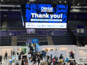 A large arena screen reads Thank you!